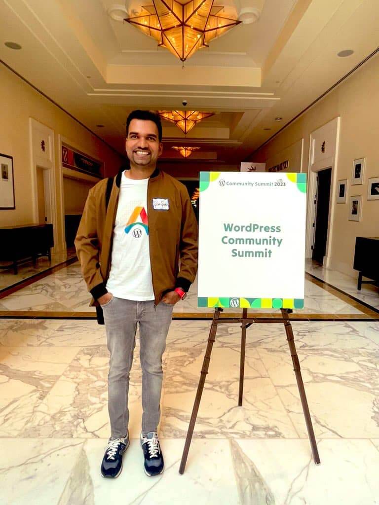 Sam Suresh with WordPress Community Summit event board